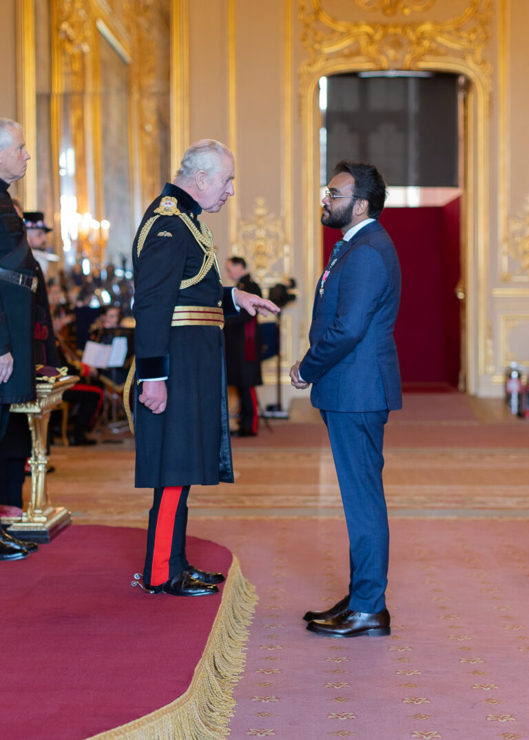 Prof Naqvi with The King receiving his MBE
